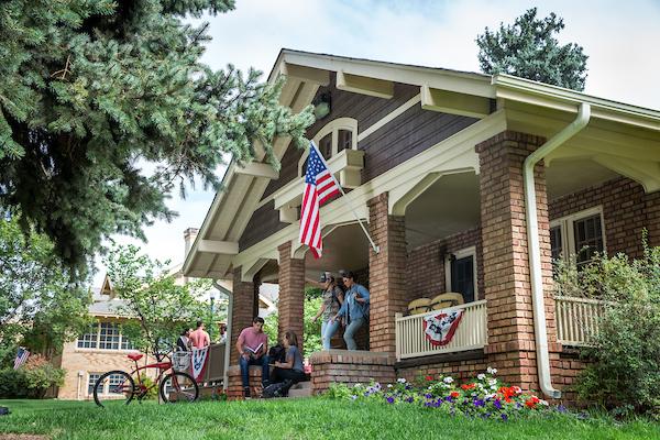 students outside the veteran service cottage